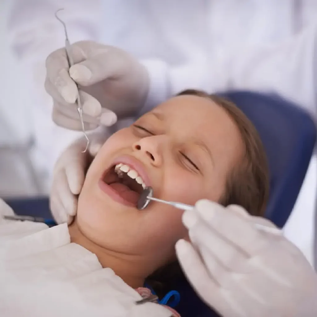 Pediatric dental specialists at Quirónsalud treating young patients with care